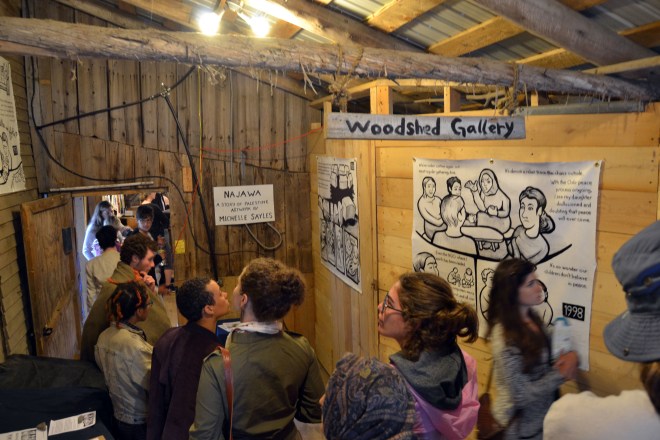 Photo of people viewing the Najawa installation at Bread & Puppet's Woodshed Gallery.