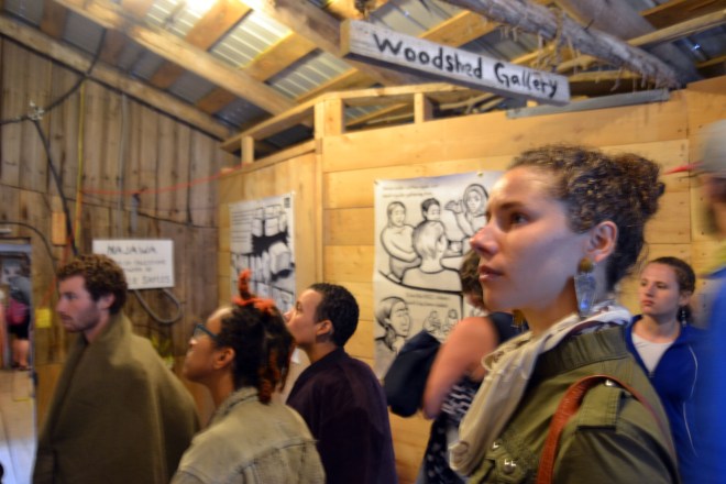Photo of people viewing the Najawa installation at Bread & Puppet's Woodshed Gallery.